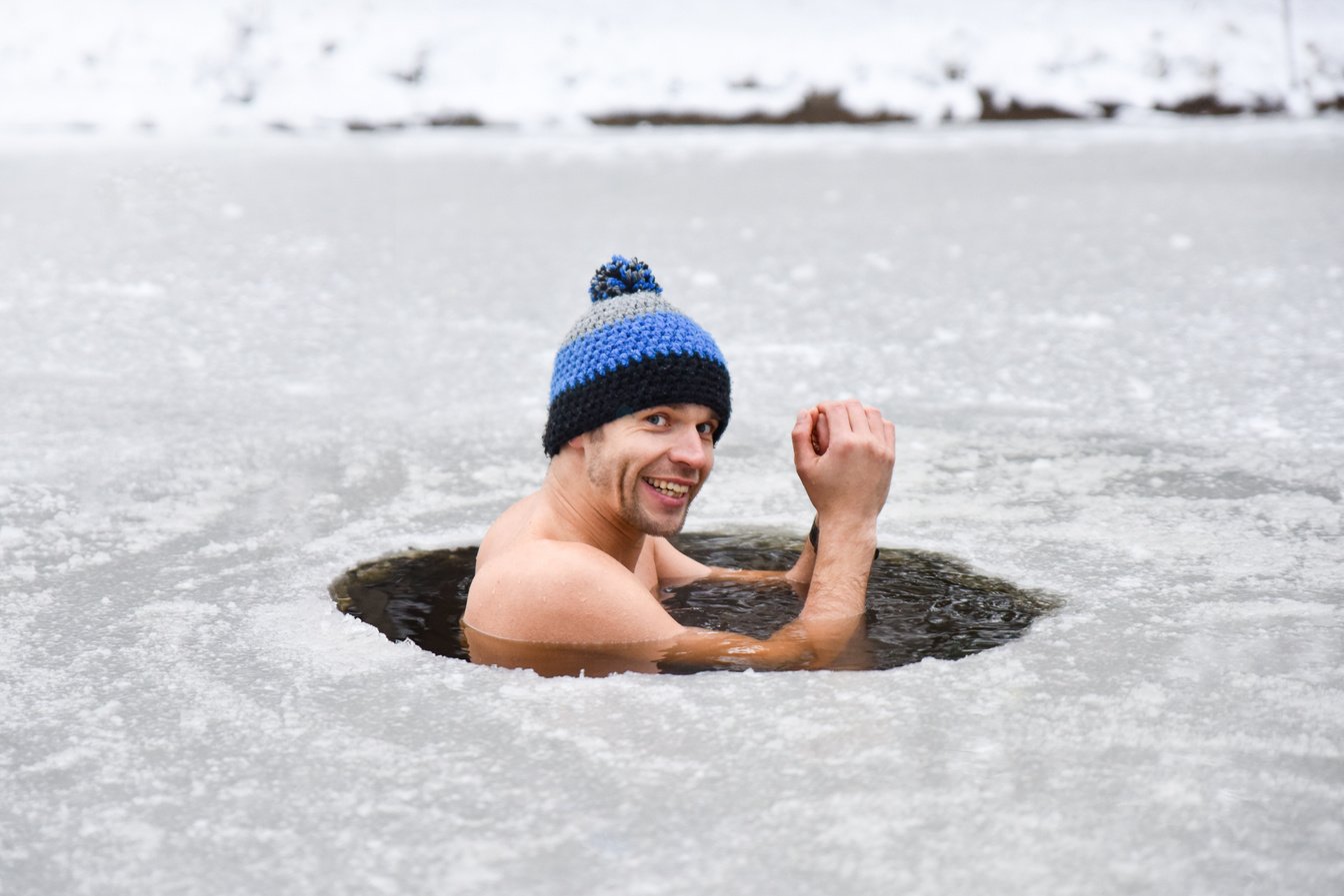 Young man have bath in cold water and does Wim hof method